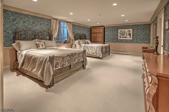 a spacious bedroom with a bed and a large mirror