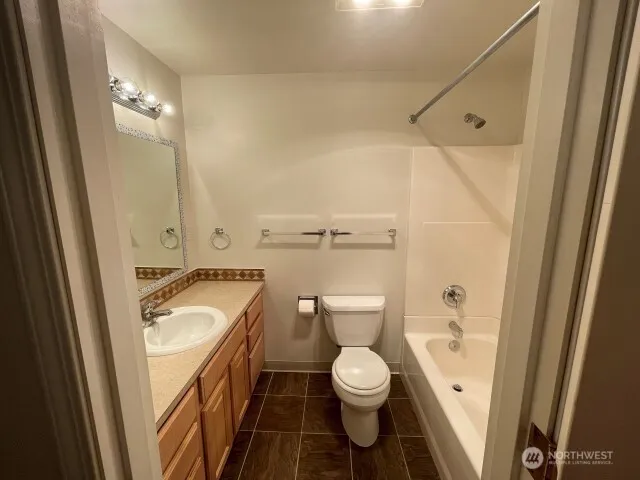 a bathroom with a toilet and a sink