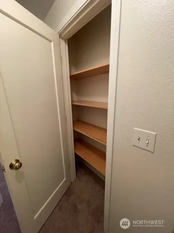 a room with a bed and furniture