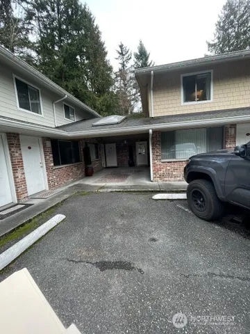 a front view of a house with garage