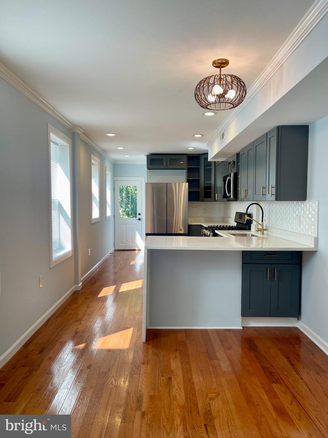 1904 Bank Street Baltimore, MD 21231 - Photo 4 of 20 a kitchen with a refrigerator and a sink