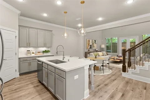 a view of kitchen with stainless steel appliances granite countertop cabinets and wooden floor
