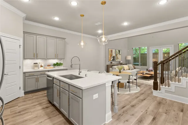 a view of kitchen with stainless steel appliances granite countertop cabinets and wooden floor