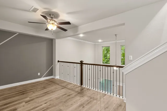a view of a livingroom with furniture and a window