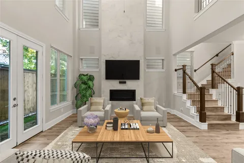 a view of a livingroom with furniture and flat screen tv