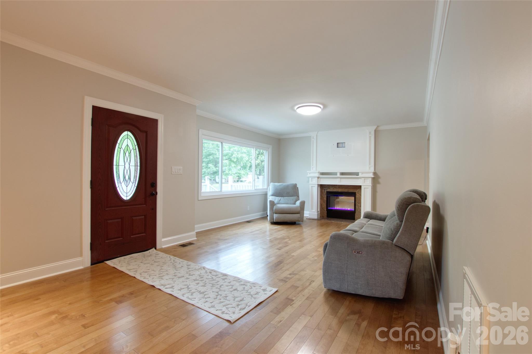 204 Clinton Avenue Clover, SC 29710 - Photo 3 of 26 a living room with furniture and a fireplace