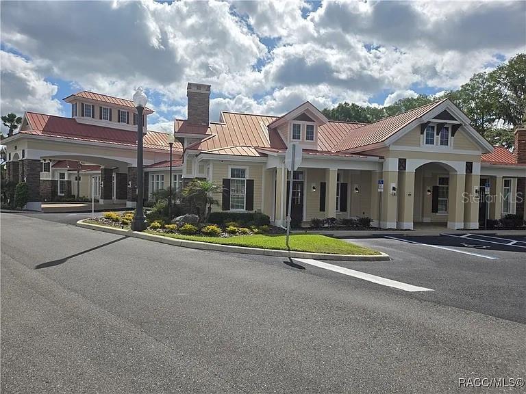 259 Bittern Loop Inverness, FL 34453 - Photo 14 of 18 a view of pool with brick walls