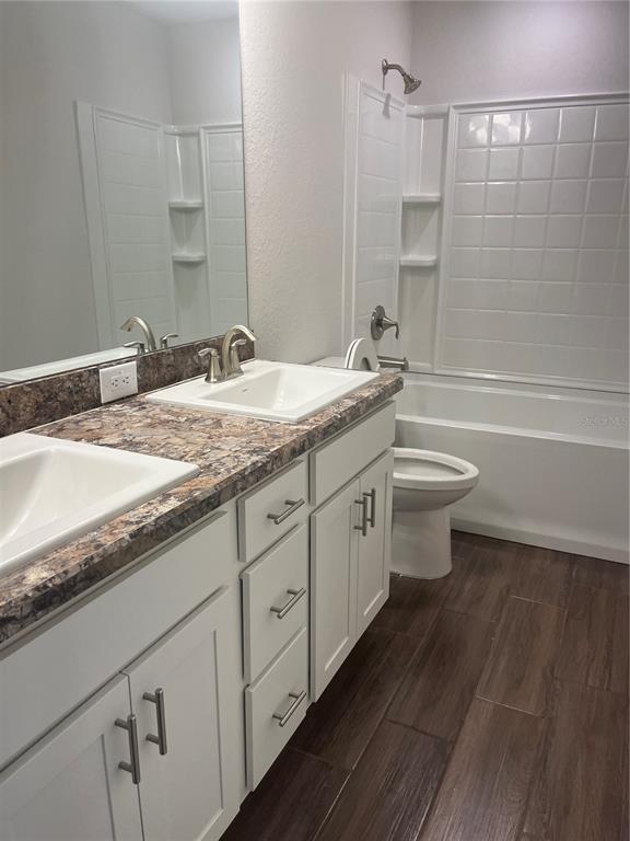 259 Bittern Loop Inverness, FL 34453 - Photo 6 of 18 a bathroom with a granite countertop sink and a mirror