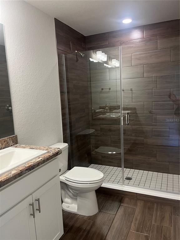 259 Bittern Loop Inverness, FL 34453 - Photo 9 of 18 a bathroom with a granite countertop toilet and a shower