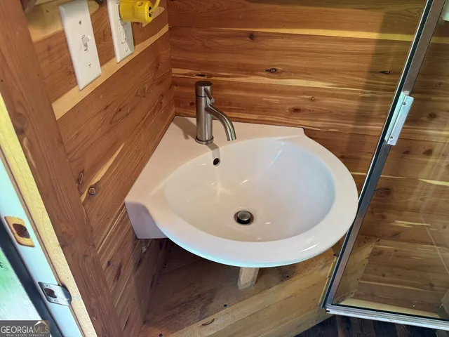 a bathroom with a sink and mirror