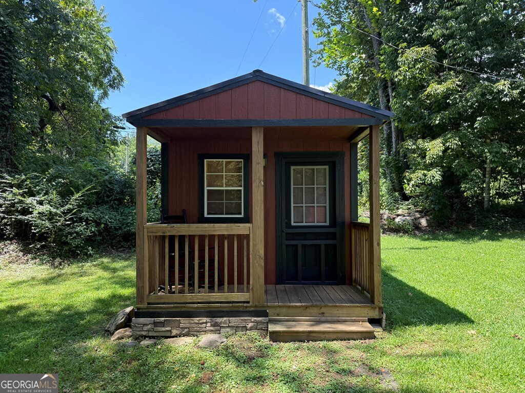 43 Wild Horse Road Sylva, NC 28779 - Photo 2 of 28 a view of wooden house with a yard