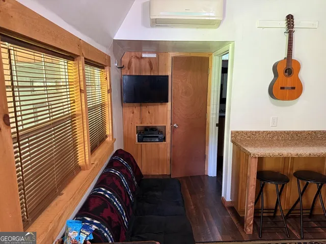 a view of living room with furniture and a flat screen tv