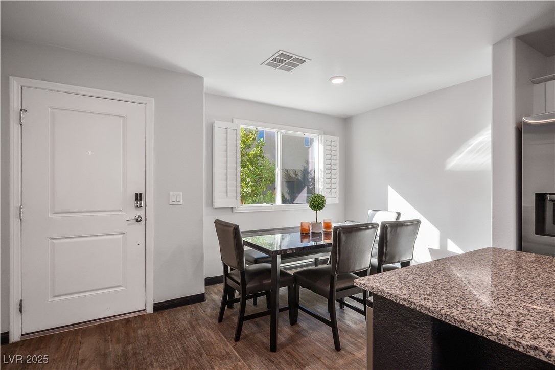 12236 Glass Desert Road, Unit 2 Las Vegas, NV 89183 - Photo 12 of 32 Dining space featuring dark wood-style floors and recessed lighting