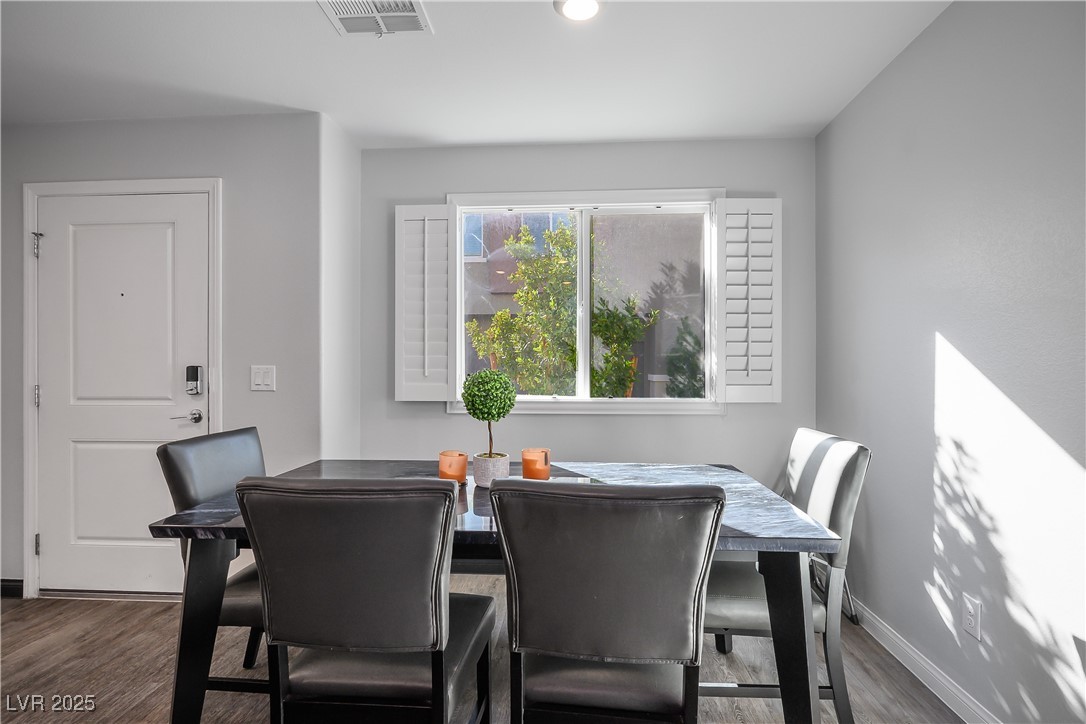 12236 Glass Desert Road, Unit 2 Las Vegas, NV 89183 - Photo 13 of 32 Dining space with dark wood finished floors and recessed lighting
