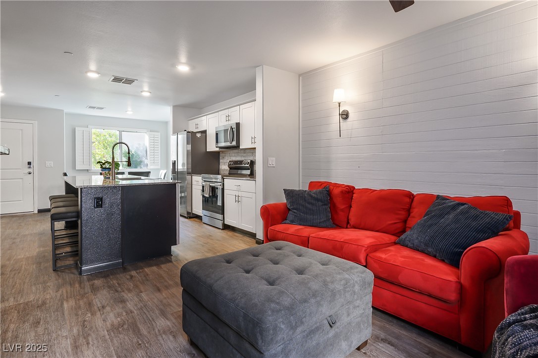 12236 Glass Desert Road, Unit 2 Las Vegas, NV 89183 - Photo 14 of 32 Living room featuring dark wood-style floors and recessed lighting