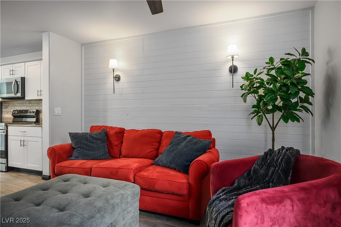 12236 Glass Desert Road, Unit 2 Las Vegas, NV 89183 - Photo 17 of 32 Living area featuring wood finished floors
