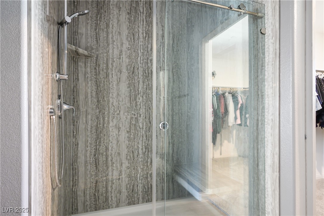 12236 Glass Desert Road, Unit 2 Las Vegas, NV 89183 - Photo 26 of 32 Full bath featuring a stall shower and a walk in closet