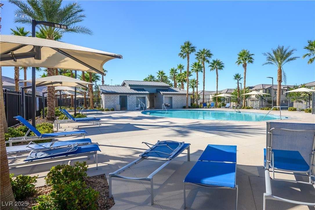 12236 Glass Desert Road, Unit 2 Las Vegas, NV 89183 - Photo 3 of 32 Community pool featuring a patio