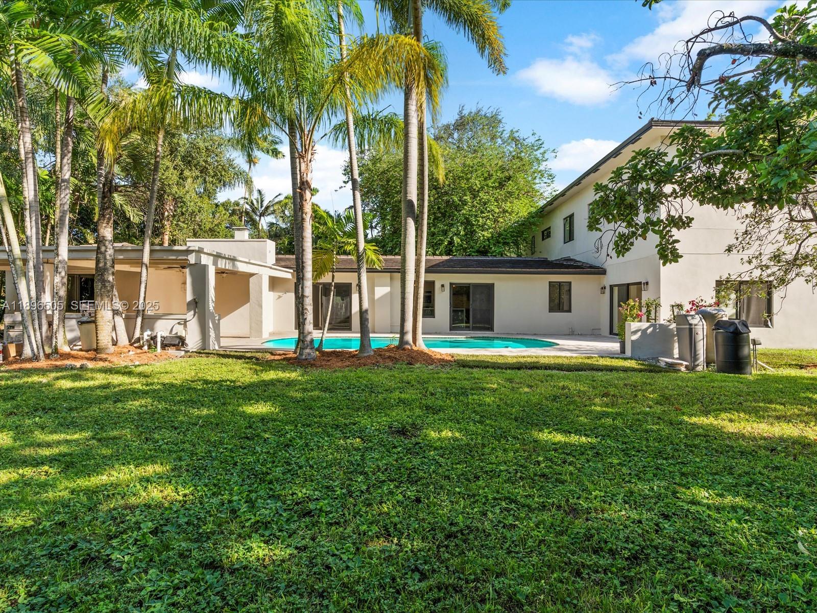 Set on a full acre of lush, tree-filled land, this property offers a beautiful backyard oasis with plenty of space to relax, play, and entertain.
