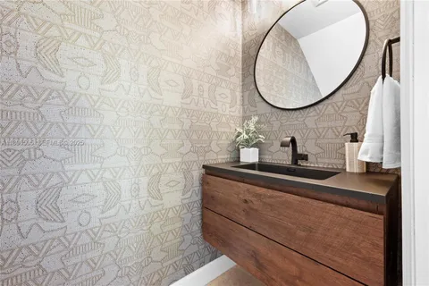 a bathroom with a tub a sink and a shower