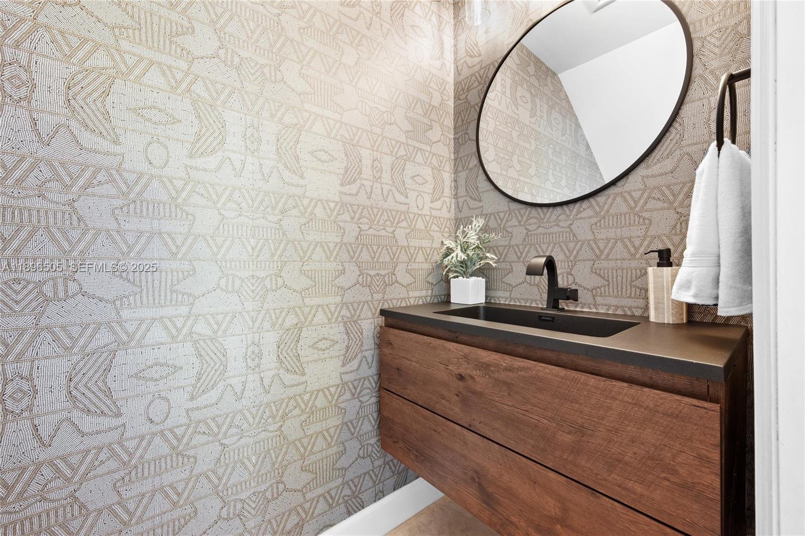 8501 Southwest 68th St Road Miami, FL 33143 - Photo 11 of 51 a bathroom with a sink and a mirror