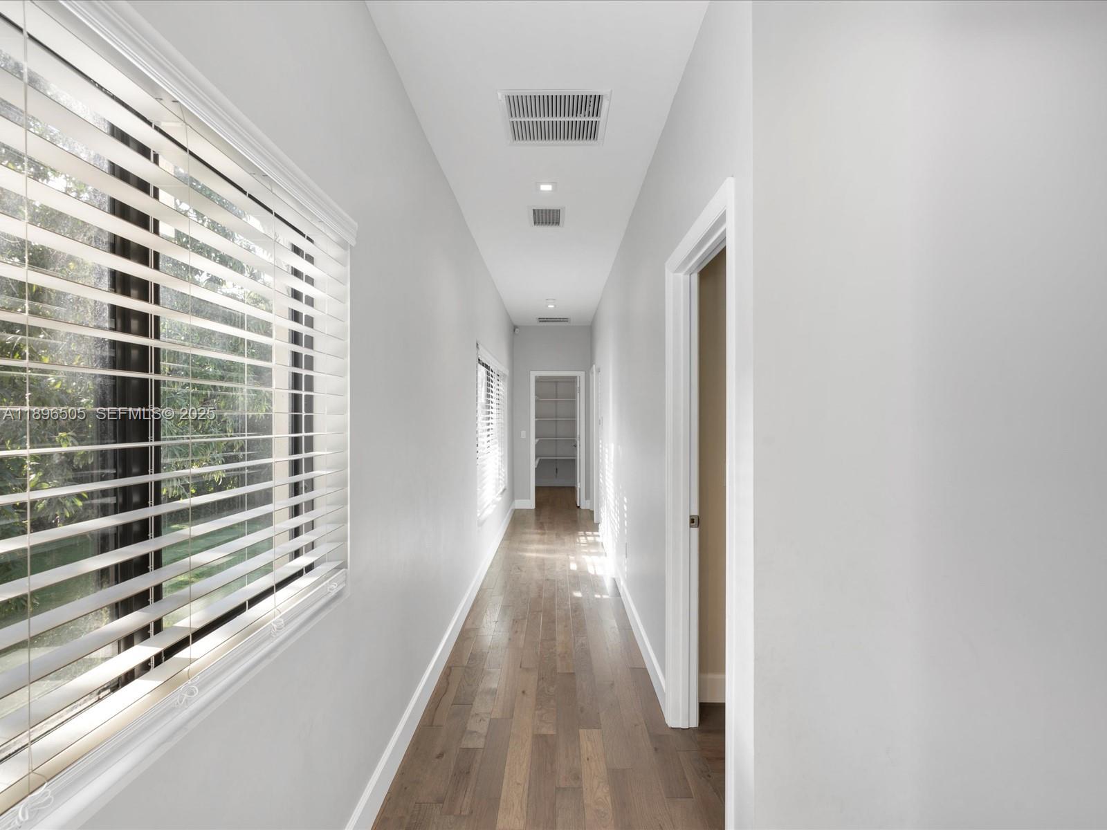 8501 Southwest 68th St Road Miami, FL 33143 - Photo 18 of 51 a view of a hallway with windows