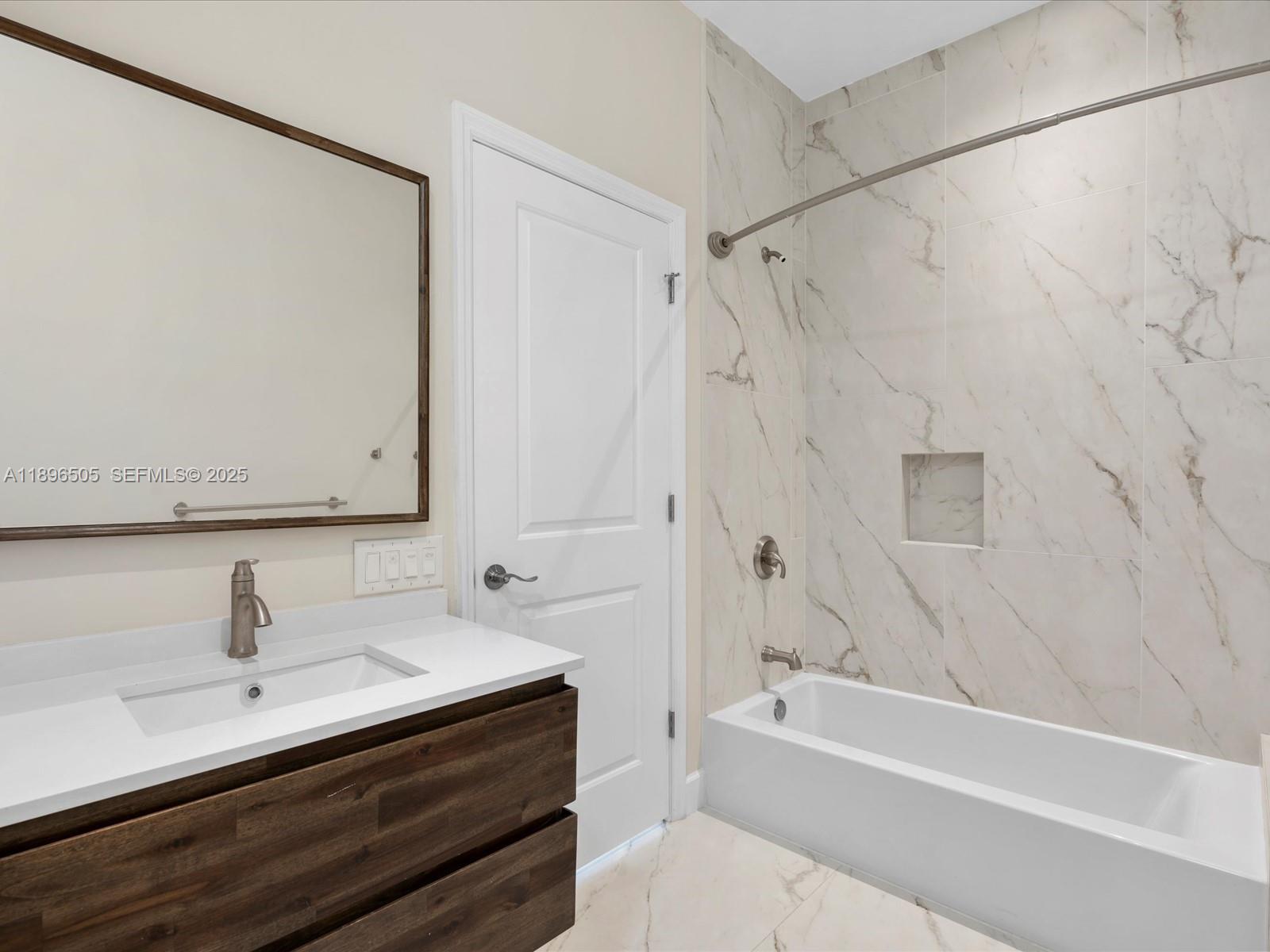 8501 Southwest 68th St Road Miami, FL 33143 - Photo 24 of 51 a bathroom with a sink and a bathtub