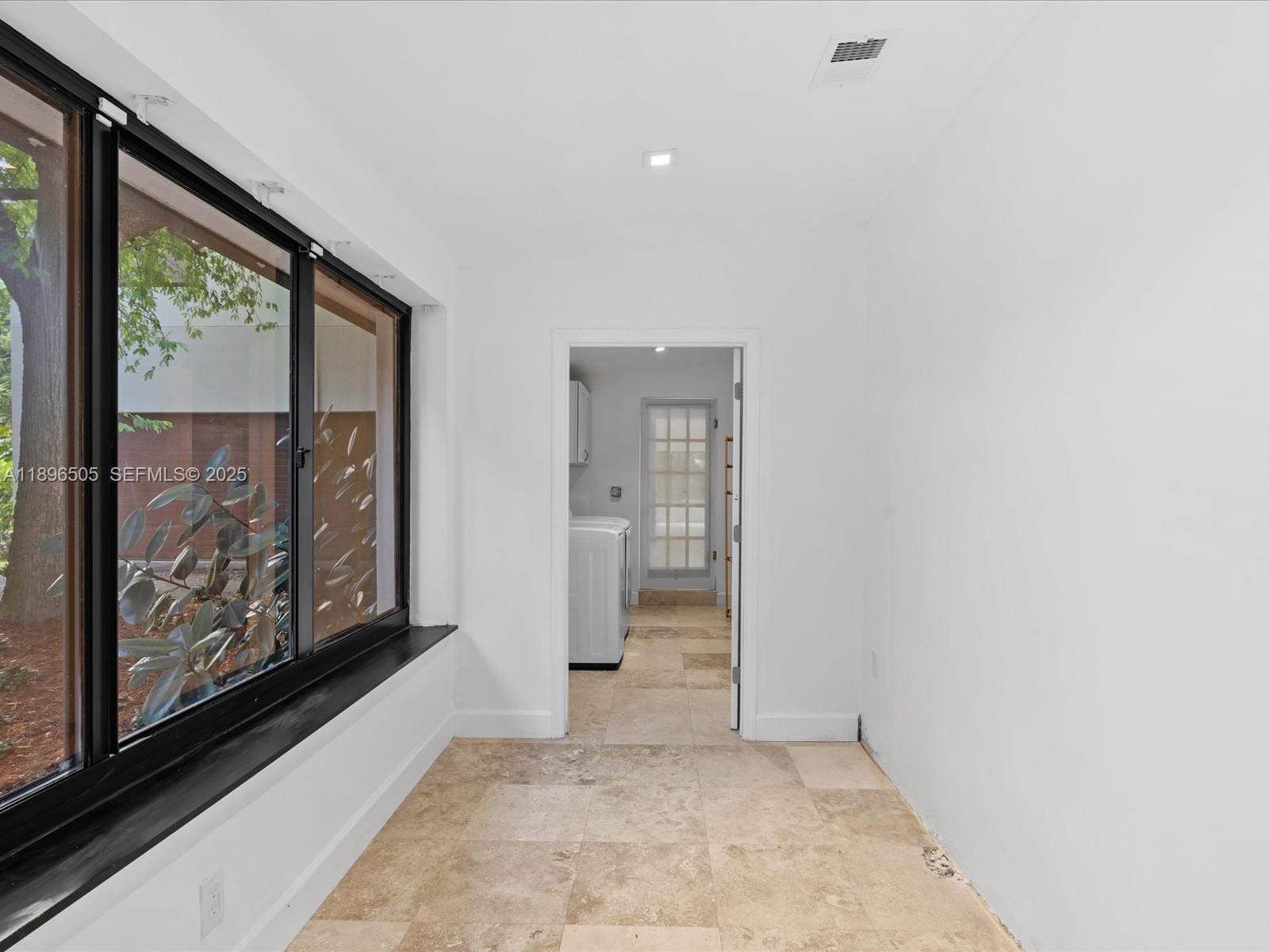 8501 Southwest 68th St Road Miami, FL 33143 - Photo 30 of 51 a view of an empty room and window