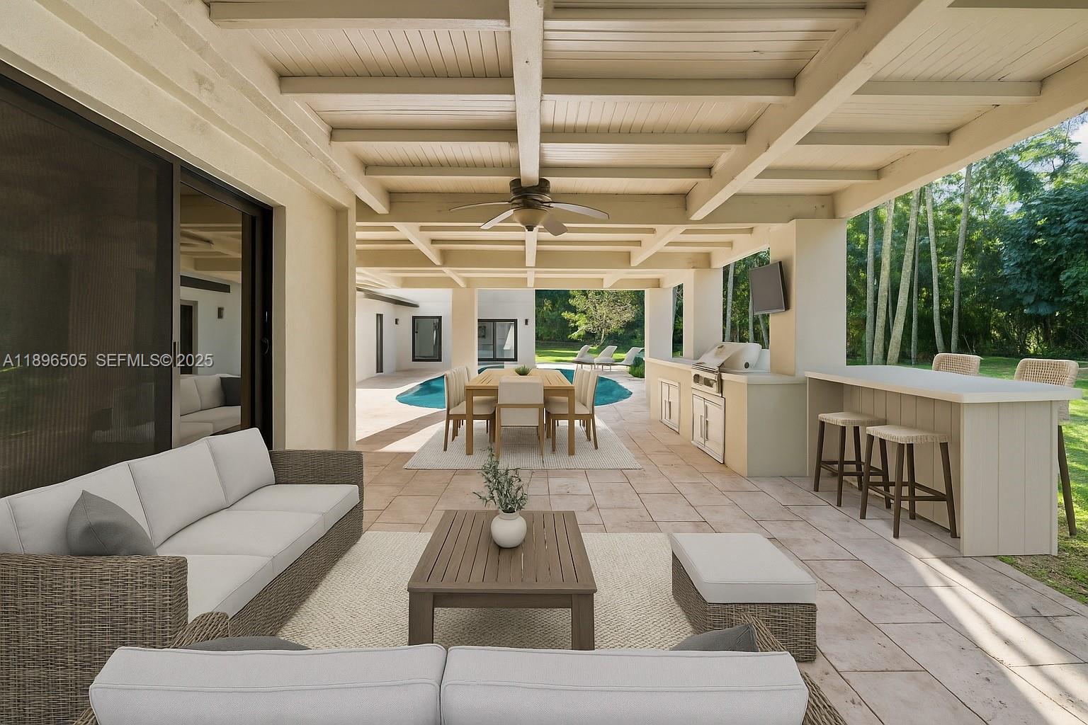 8501 Southwest 68th St Road Miami, FL 33143 - Photo 34 of 51 a living room with furniture and a large window