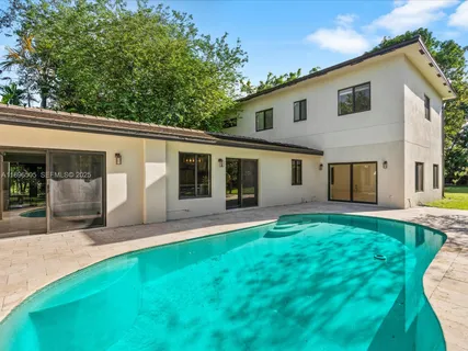 a view of a street with a tree