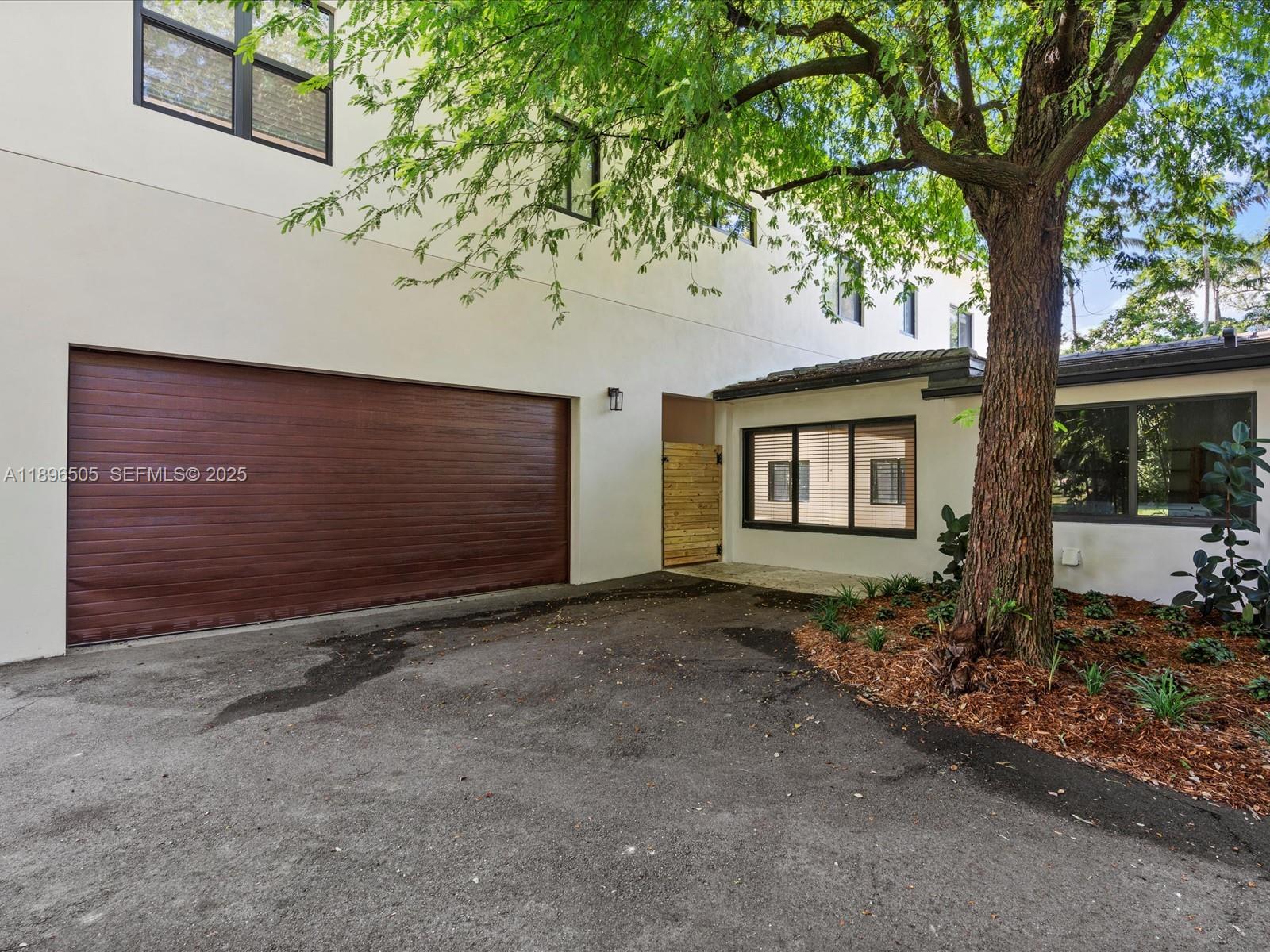 8501 Southwest 68th St Road Miami, FL 33143 - Photo 47 of 51 a front view of a house with garden