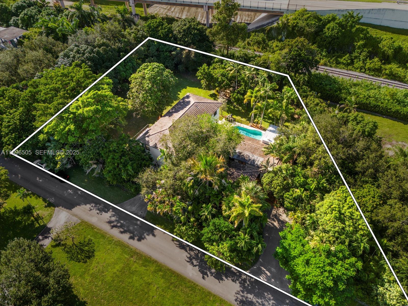 8501 Southwest 68th St Road Miami, FL 33143 - Photo 49 of 51 a view of a yard with a plant in a balcony