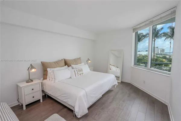 a bathroom with a bathtub shower sink vanity and toilet