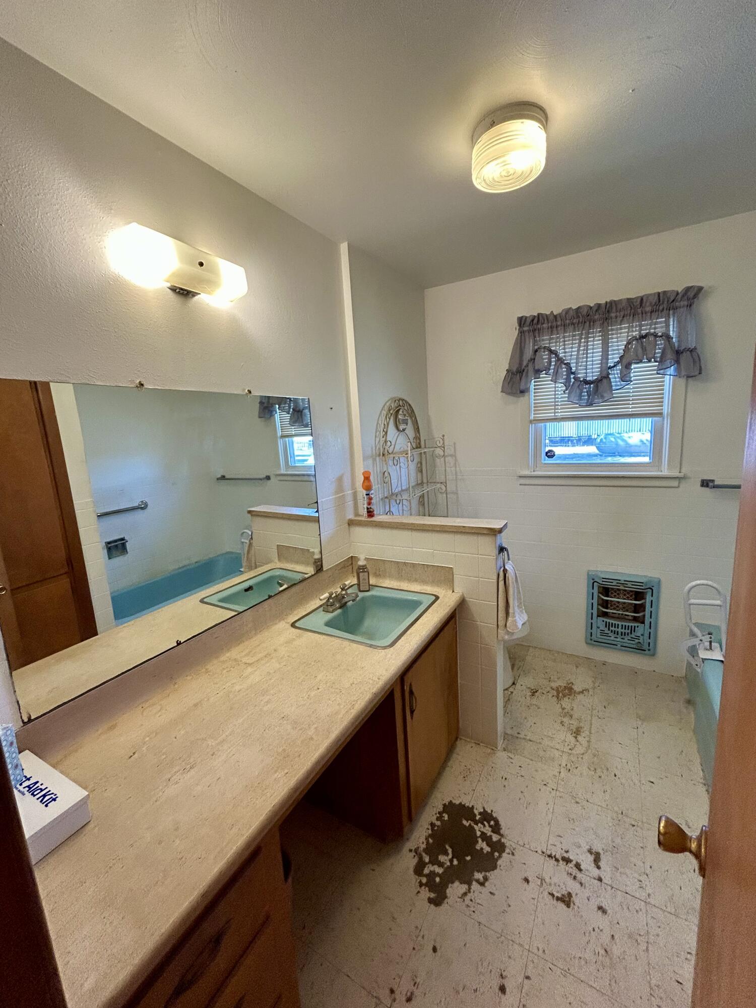 2101 Farm To Market 97 Lockney, TX 79241 - Photo 18 of 35 a bathroom with a granite countertop sink and a large mirror