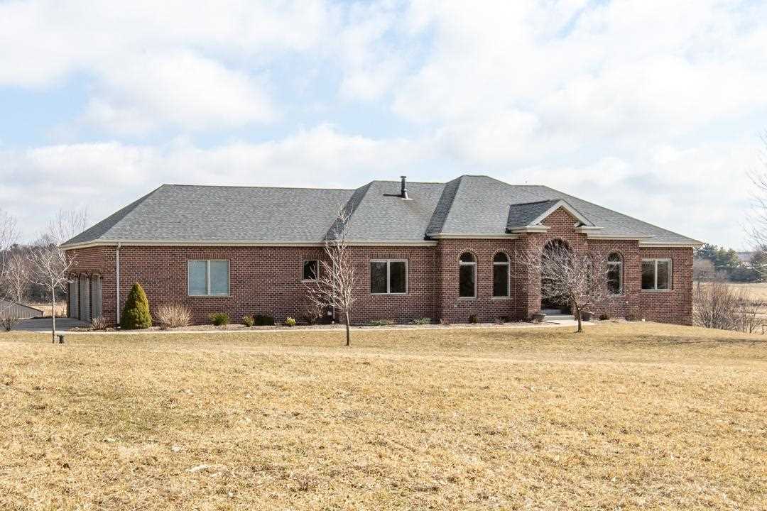 3097 North Marrill Road Byron, IL 61010 - Photo 1 of 40 a house that has a tree in front of it
