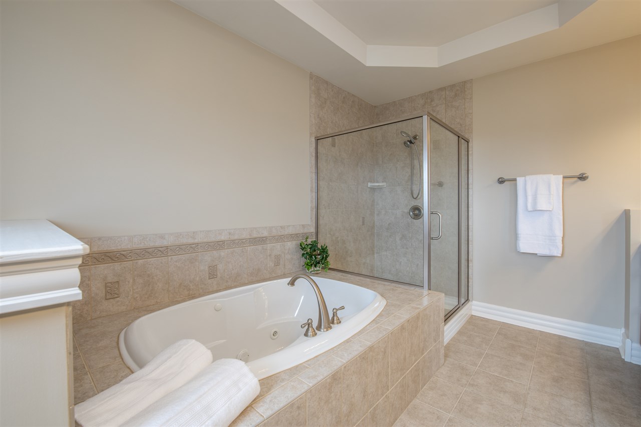 3097 North Marrill Road Byron, IL 61010 - Photo 17 of 40 a bathroom with a bathtub and a shower