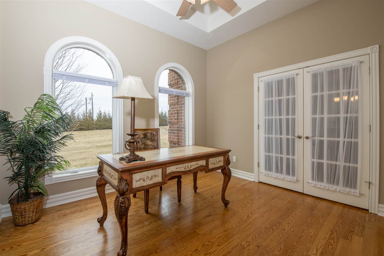 3097 North Marrill Road Byron, IL 61010 - Photo 3 of 40 a view of a room with furniture and wooden floor
