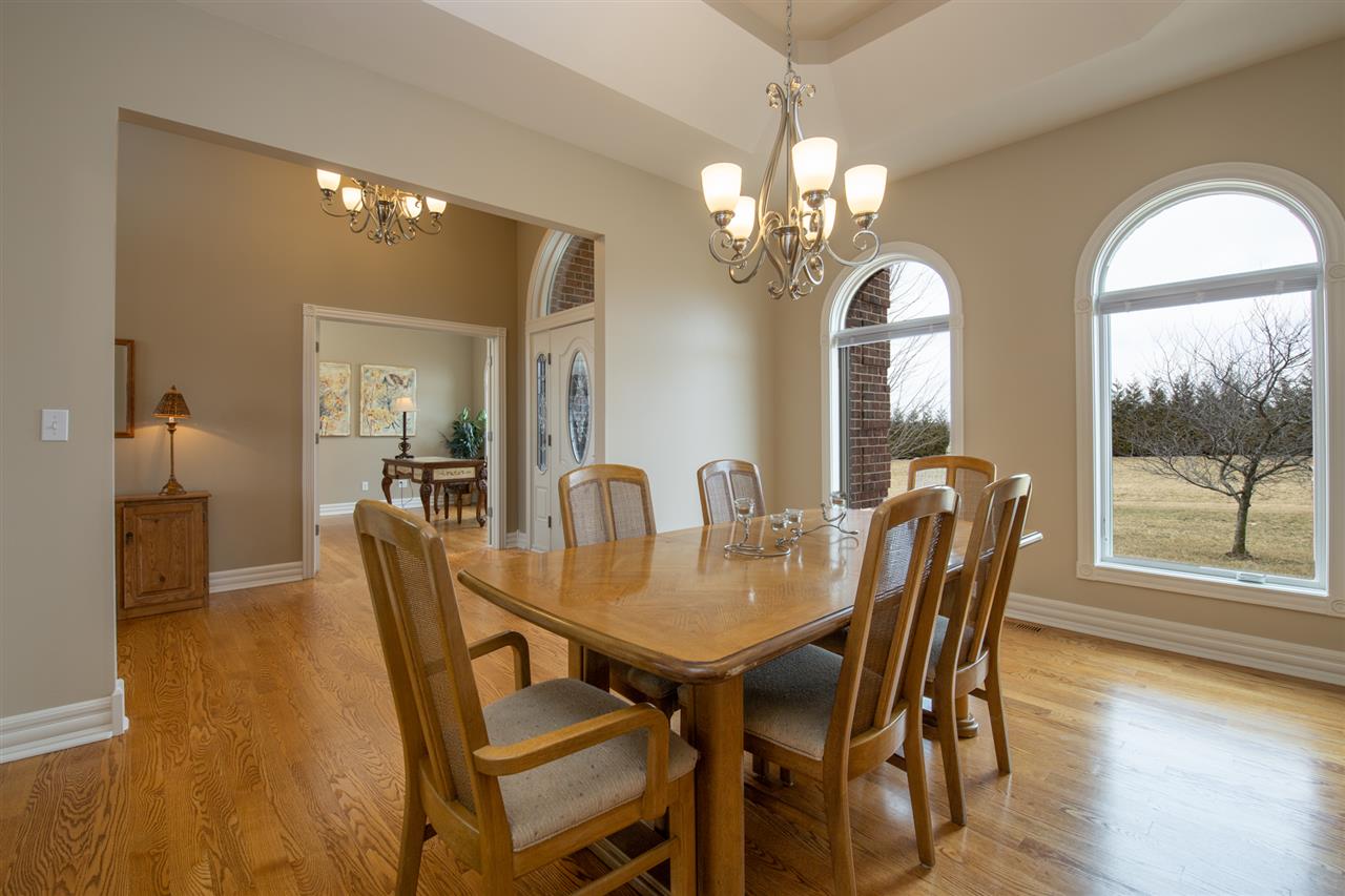 3097 North Marrill Road Byron, IL 61010 - Photo 8 of 40 a view of a dining room with furniture and wooden floor