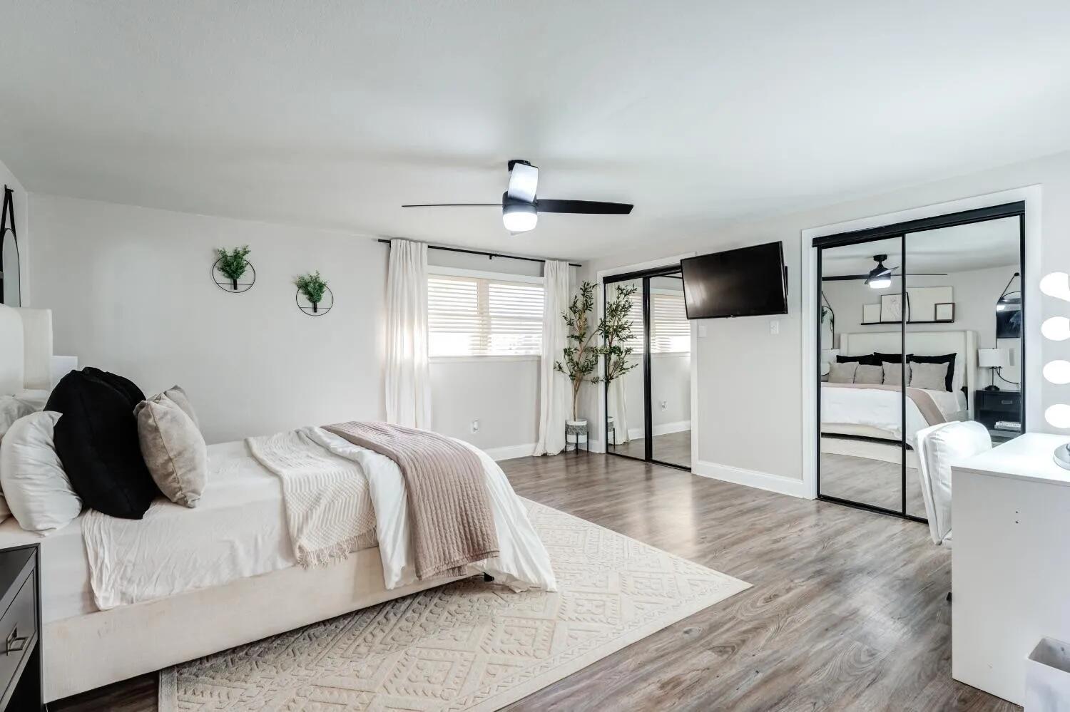 2407 46th Street Lubbock, TX 79412 - Photo 5 of 10 a bedroom with a bed and a large window