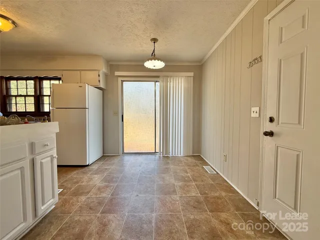 a view of a kitchen with a refrigerator a sink and dishwasher