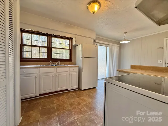 a utility room with faucet washer and dryer