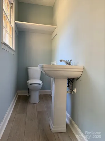 a bathroom with a sink and toilet