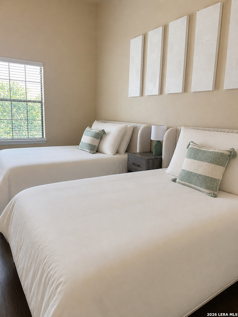 6160 Eckhert Road, Unit 804 San Antonio, TX 78240 - Photo 26 of 38 a bed sitting in a bedroom next to a window