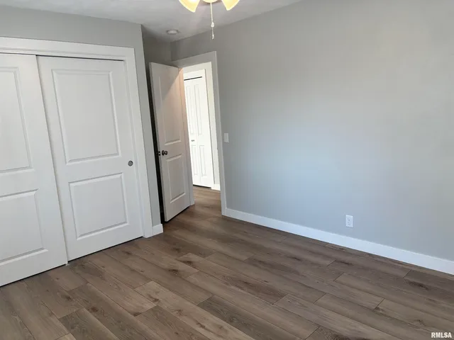 a view of a livingroom with wooden floor