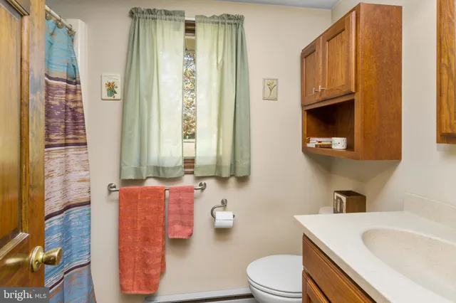a bathroom with a shower and a sink