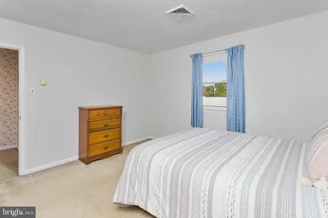 a view of room with window and hardwood floor