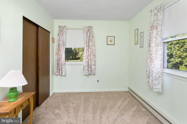 a bathroom with a sink toilet and mirror