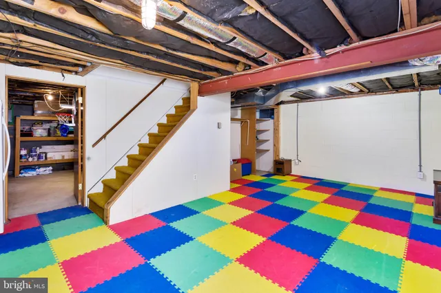 a room with pool table and window