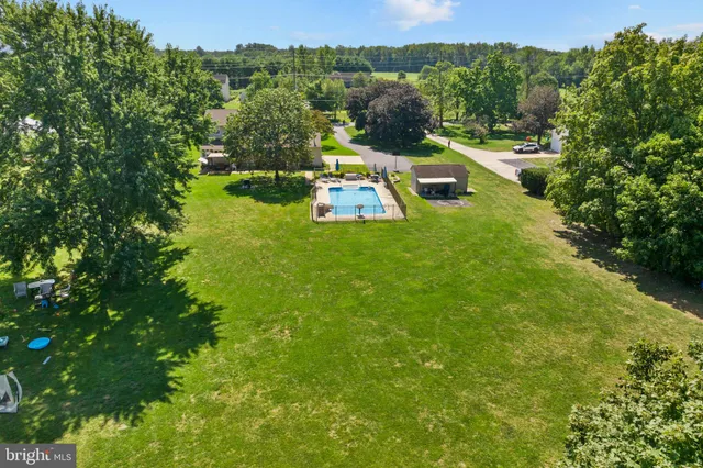 a view of a garden with houses