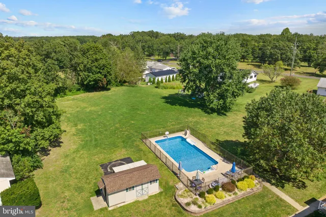 a backyard of a house with a yard and garage